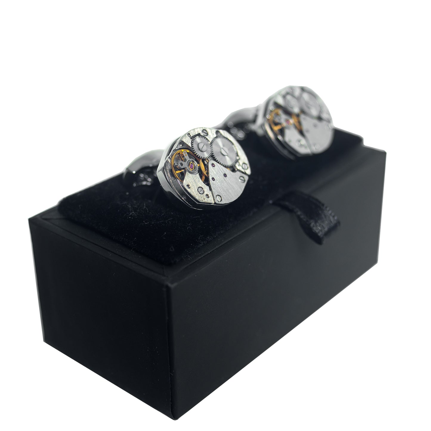 A pair of Foxtrot Chronolinks oval cufflink on their display box