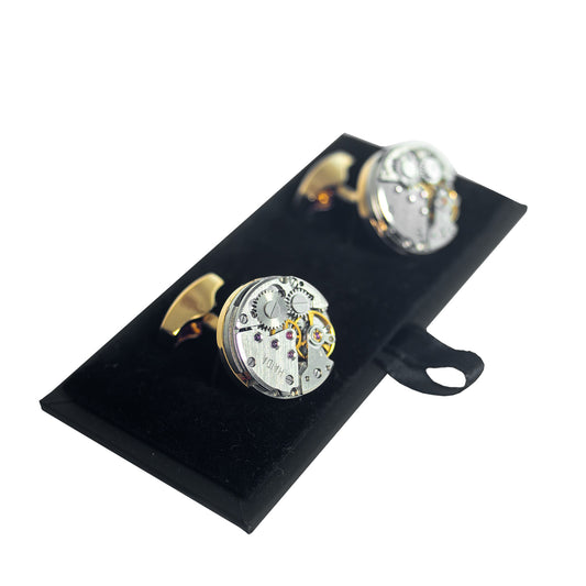 A pair of Foxtrot Chronolinks Golden cufflink