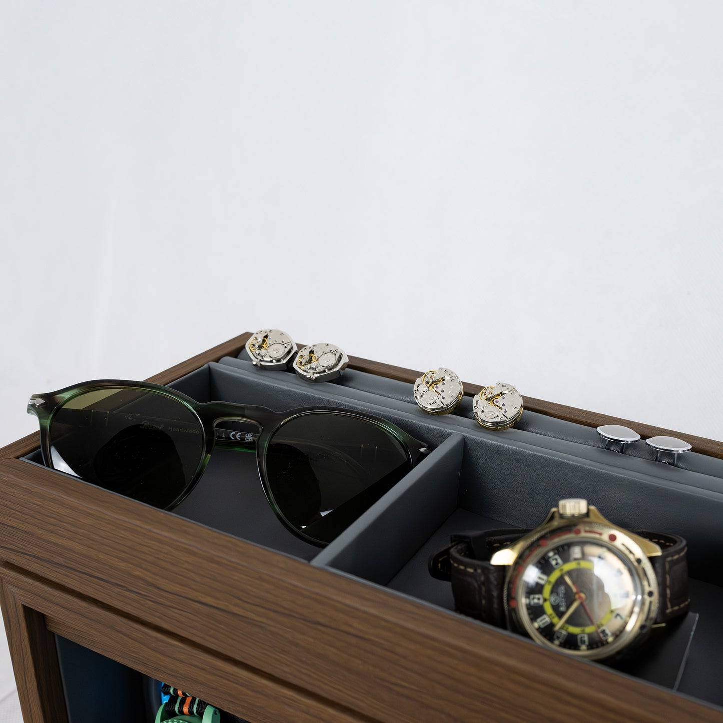 Close-up of the accessories compartments of a Foxtrot Horomaster Grey wooden watch winder